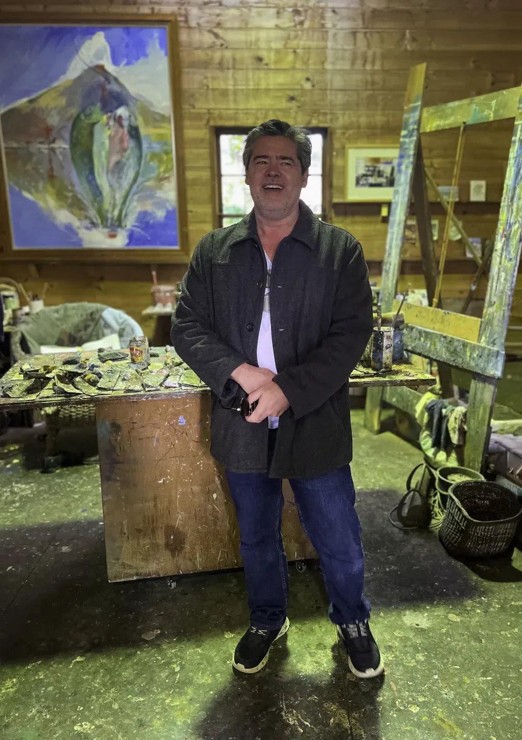 James McGrath standing beside an easel in Arthur Boyd's studio